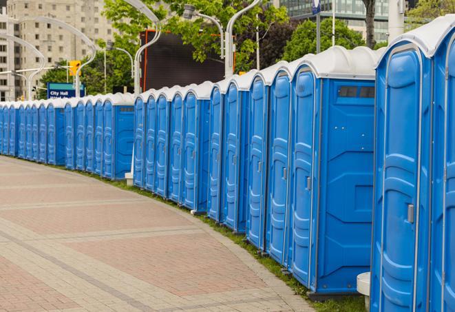 a row of portable restrooms set up for a special event, providing guests with a comfortable and sanitary option in Arvada